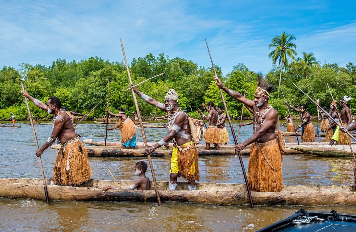 1200px-Canoe_Warriers_in_West_Papua